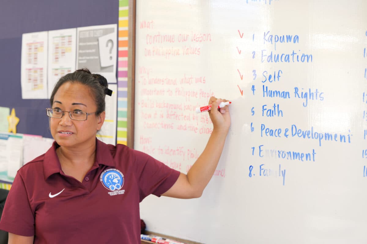 Instructor developing course objectives and workshop notes.